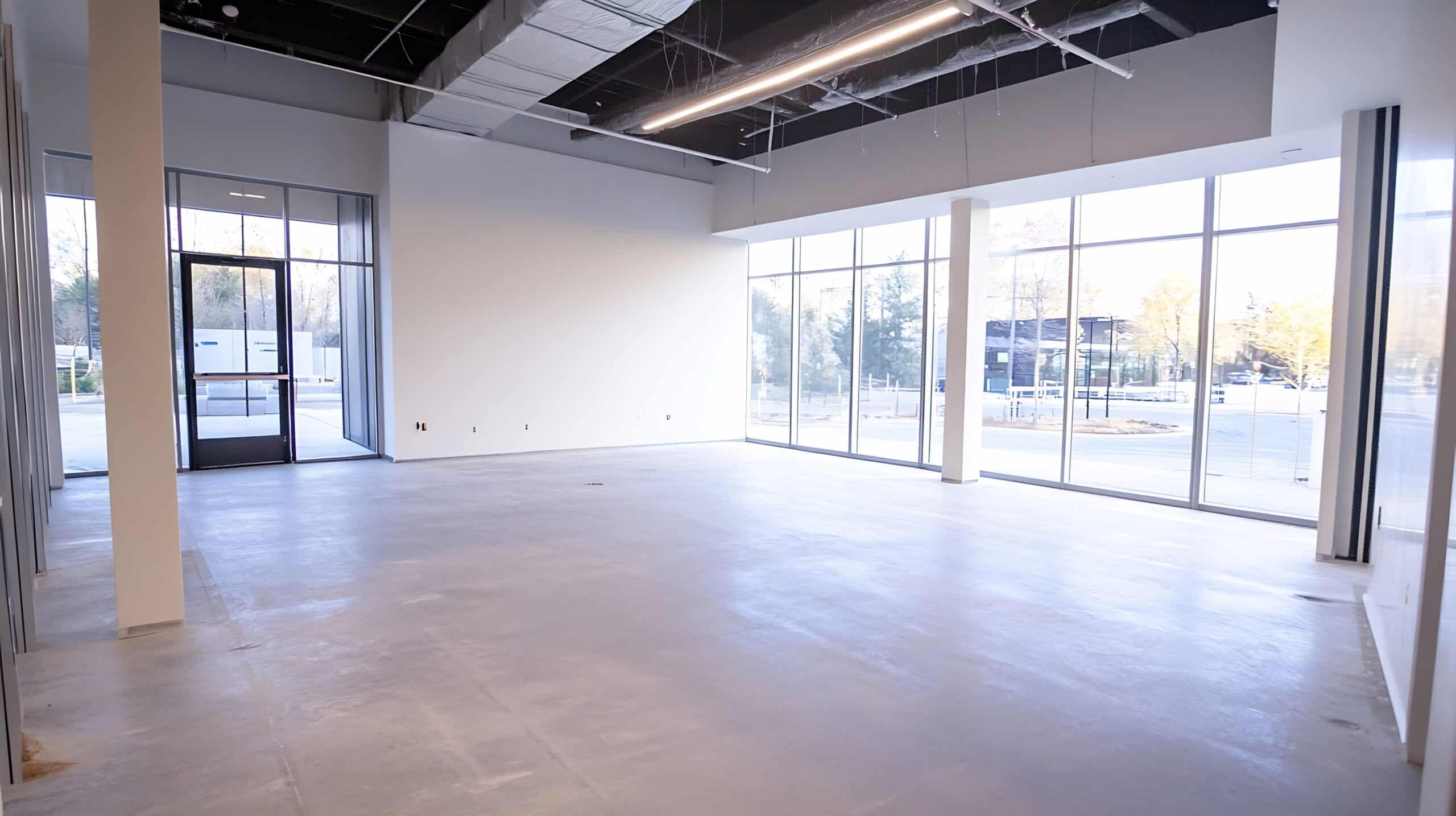 Modern Unoccupied Retail Space with Large Windows and Natural Light : Generative AI